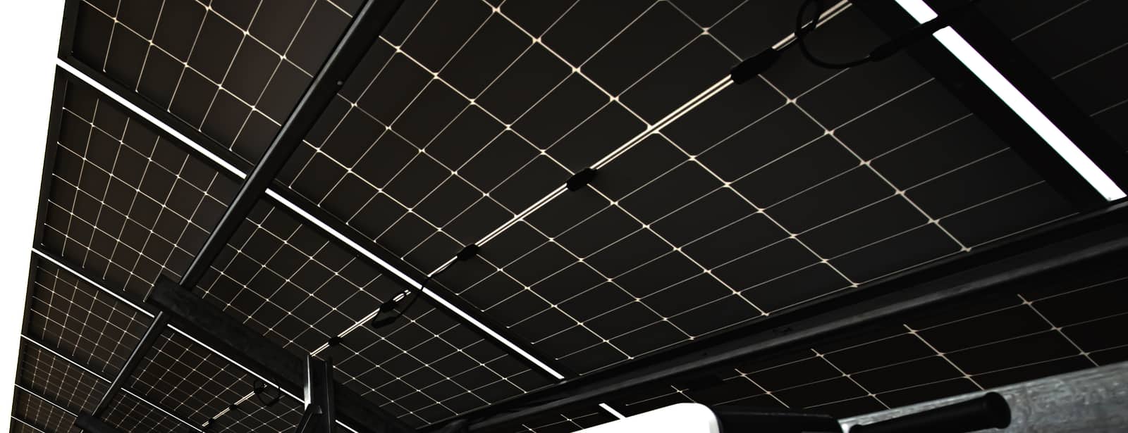 View from beneath the solar array, with inverter cabinets to the right.